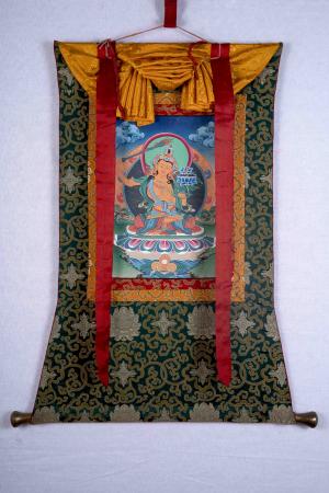 Silk Brocade Mounted Manjushree Thangka With Wooden Dowels And Metal Decorative Handle